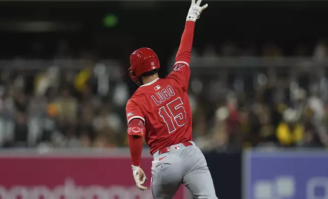 Los Angeles Angels' Matthew Lugo celebrates after hitting a two-run home run during the seventh inning of a baseball game against the San Diego Padres Tuesday, May 13, 2025, in San Diego. (AP Photo/Gregory Bull)