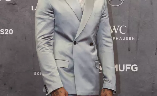 FILE - British reigning F1 drivers champion Lewis Hamilton arrives for the 2020 Laureus World Sports Awards in Berlin, Germany, Monday, Feb. 17, 2020. (AP Photo/Michael Sohn, File)