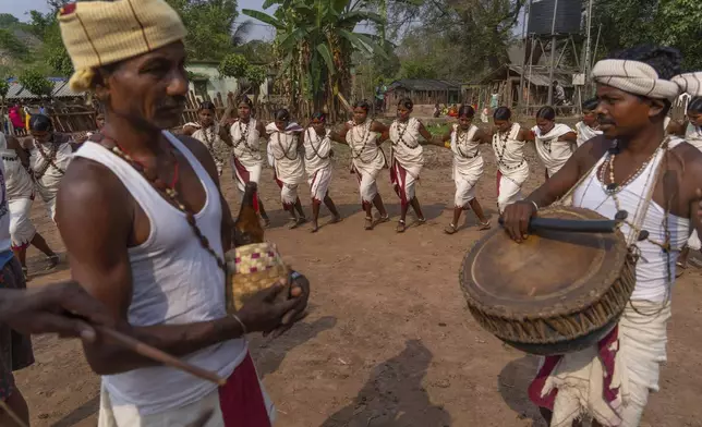 Members of the Durua tribe, part of India's Indigenous Adivasis communities, perform traditional dances during the Chaitra Parab festival, a month long harvest celebration in Hatipakna village, Koraput district, in India's eastern state of Odisha, Thursday, April 17, 2025. (AP Photo/Rafiq Maqbool)