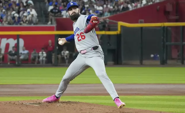 Los Angeles Dodgers pitcher Tony Gonsolin throws against the Arizona Diamondbacks during the first inning of a baseball game Sunday, May 11, 2025, in Phoenix. (AP Photo/Darryl Webb)