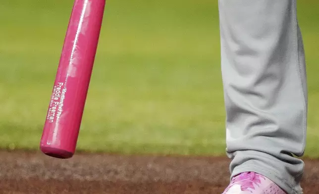 Los Angeles Dodgers' Freddie Freeman stands in the batter's box with a pink bat in honor of Mother's Day during the first inning of a baseball game against the Arizona Diamondbacks, Sunday, May 11, 2025, in Phoenix. (AP Photo/Darryl Webb)