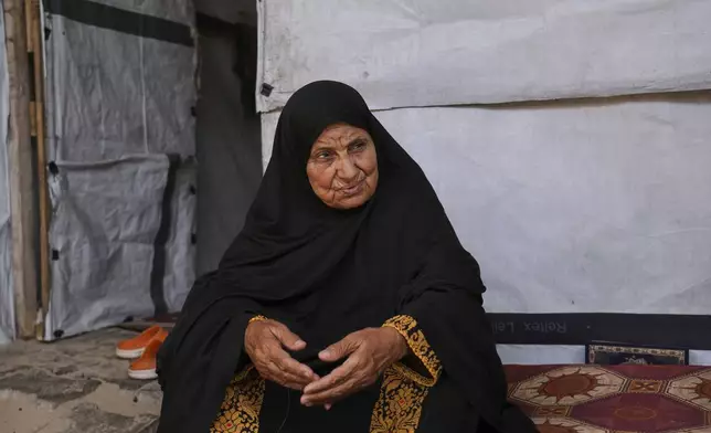 Ghalia Abu Moteir, whose family fled what is now Israel during the 1948 war that surrounded its creation, shelters from the current war in a tent in Khan Younis, Gaza Strip, after being displaced from her home in Rafah, Wednesday, May 14, 2025. (AP Photo/Abdel Kareem Hana)
