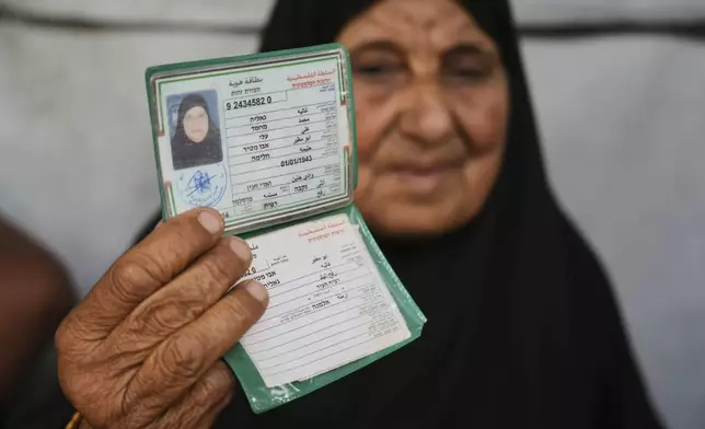 Ghalia Abu Moteir, whose family fled what is now Israel during the 1948 war that surrounded its creation, shelters from the current war in a tent in Khan Younis, Gaza Strip, after being displaced from her home in Rafah, Wednesday, May 14, 2025. (AP Photo/Abdel Kareem Hana)