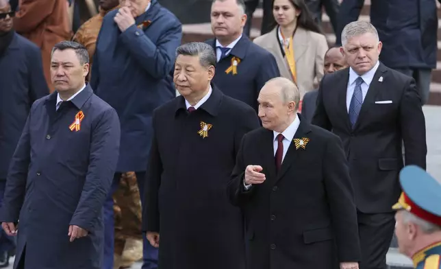 From left: Kyrgyz President Sadyr Japarov Chinese President Xi Jinping, Russian President Vladimir Putin and Slovakia's Prime Minister Robert Fico attend a wreath laying ceremony at the Tomb of the Unknown Soldier in Alexander Garden after the Victory Day military parade in Moscow, Russia, Friday, May 9, 2025, during celebrations of the 80th anniversary of the Soviet Union's victory over Nazi Germany during the World War II. (Yuri Kochetkov/Pool Photo via AP)