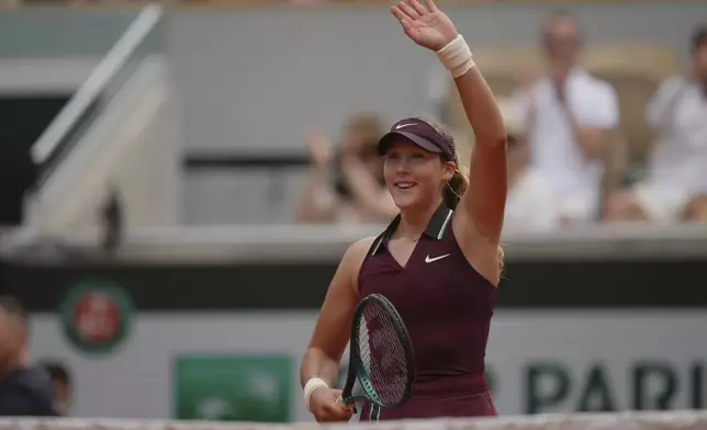 Russia's Mirra Andreeva celebrates beating Kazakhstan's Yulia Putintseva following their third round match of the French Tennis Open, at the Roland-Garros stadium, in Paris, Saturday, May 31, 2025. (AP Photo/Thibault Camus)