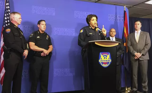 FILE - Phoenix Police Chief Jeri Williams speaks at a news conference about the linking of nine homicides to a convicted felon on Jan. 18, 2018, in Phoenix, Ariz. (AP Photo/Terry Tang, File)
