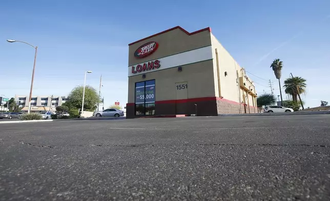 FILE - A sparse parking lot is seen Jan. 18, 2018, in Phoenix, where police say a double homicide previously took place that is linked to Cleophus Cooksey. The double homicide at the location took place on Monday, Nov. 27, 2017. (AP Photo/Ross D. Franklin, File)