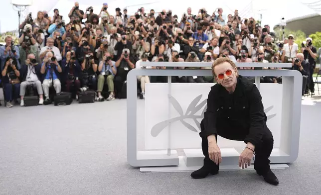 Bono poses for photographers at the photo call for the film 'Bono: Stories of Surrender' at the 78th international film festival, Cannes, southern France, Saturday, May 17, 2025. (Photo by Scott A Garfitt/Invision/AP)