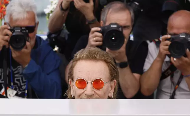 Bono poses for photographers at the photo call for the film 'Bono: Stories of Surrender' at the 78th international film festival, Cannes, southern France, Saturday, May 17, 2025. (Photo by Joel C Ryan/Invision/AP)