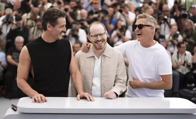 Pedro Pascal, from left, director Ari Aster and Joaquin Phoenix pose for photographers at the photo call for the film 'Eddington' at the 78th international film festival, Cannes, southern France, Saturday, May 17, 2025. (Photo by Scott A Garfitt/Invision/AP)