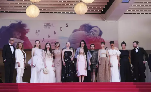 Producer Lucas Schmidt, from left, producer Maren Schmitt, Luzia Oppermann, Laeni Geiseler, Susanne Wust, from sixth left, Hanna Heckt, director Mascha Schilinski, Lena Urzendowsky, Lea Drinda, Luise Heyer, writer Louise Peters and cinematographer Fabian Gamper pose for photographers upon arrival at the premiere of the film 'Sound of Falling' at the 78th international film festival, Cannes, southern France, Wednesday, May 14, 2025. (Photo by Lewis Joly/Invision/AP)