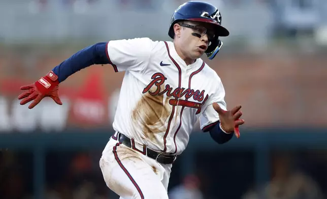 Atlanta Braves' Alex Verdugo rounds third to score after a double by Austin Riley during the third inning of a baseball game against the Cincinnati Reds, Monday, May 5, 2025, in Atlanta. (AP Photo/Butch Dill)