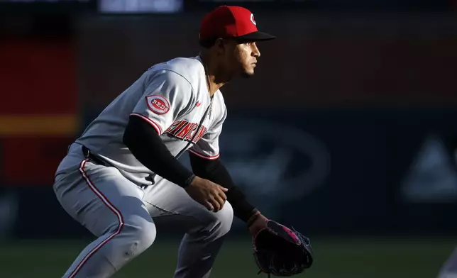 Cincinnati Reds third baseman Santiago Espinal gets ready for a play during the first inning of a baseball game against the Atlanta Braves, Monday, May 5, 2025, in Atlanta. (AP Photo/Butch Dill)