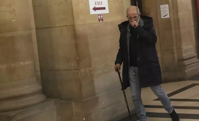 Defendant Aomar Aït Khedache, one of the men accused in the 2016 armed robbery of Kim Kardashian, leaves after the verdict in the trial of Kim Kadashian heist, Friday, May 23, 2025 in Paris. (AP Photo/Christophe Ena)