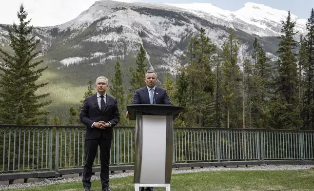 Ukraine Minister of Finance, Sergii Marchenko, right, and Canada's Finance Minister Francois-Philippe Champagne speak to the media prior to the G7 Finance Ministers meeting in Banff, Alberta, Tuesday, May 20, 2025. (Jeff McIntosh/The Canadian Press via AP)