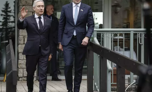 Ukraine Minister of Finance, Sergii Marchenko, right, and Canada's Finance Minister Francois-Philippe Champagne arrive to speak to the media prior to the G7 Finance Ministers meeting in Banff, Alberta, Tuesday, May 20, 2025. (Jeff McIntosh/The Canadian Press via AP)