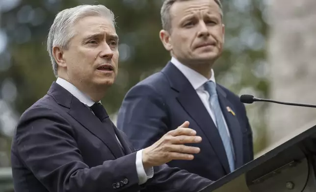 Ukraine Minister of Finance, Sergii Marchenko, right, and Canada's Finance Minister Francois-Philippe Champagne speak to the media prior to the G7 Finance Ministers meeting in Banff, Alberta, Tuesday, May 20, 2025. (Jeff McIntosh/The Canadian Press via AP)