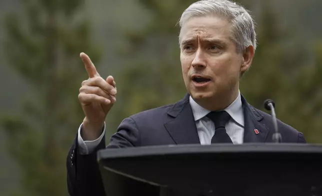 Canada's Finance Minister Francois-Philippe Champagne speaks to the media prior to the G7 Finance Ministers meeting in Banff, Alberta, Tuesday, May 20, 2025. (Jeff McIntosh/The Canadian Press via AP)
