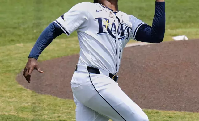 Tampa Bay Rays third base Junior Caminero catches a pop fly by Kansas City Royals' Michael Massey during the second inning of a baseball game Thursday, May 1, 2025, in Tampa, Fla. (AP Photo/Chris O'Meara)