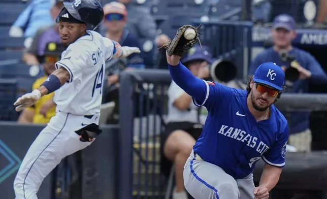 Kansas City Royals first base Vinnie Pasquantino gets Tampa Bay Rays' Chandler Simpson (14) out on a close play during the first inning of a baseball game Thursday, May 1, 2025, in Tampa, Fla. (AP Photo/Chris O'Meara)