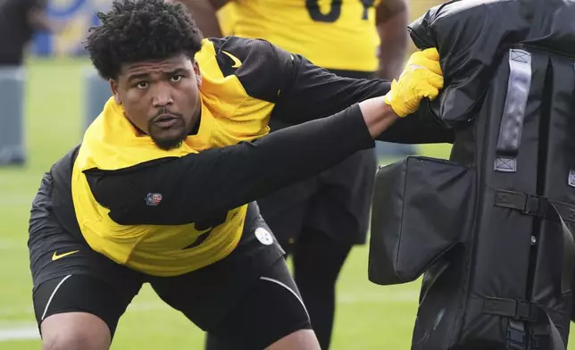 Pittsburgh Steelers first round draft pick Derrick Harmon (99) works a drill during the NFL football team's rookie camp in Pittsburgh, Friday, May 9, 2025. (AP Photo/Gene J. Puskar)