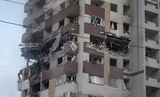 Damage is seen to an apartment building after Israeli attacks in Tehran, Friday, June 13, 2025. (AP Photo/Vahid Salemi)
