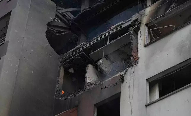 Damage is seen in a building after an explosion in a residence compound after Israel attacked Iran's capital Tehran, Friday, June 13, 2025. (AP Photo/Vahid Salemi)