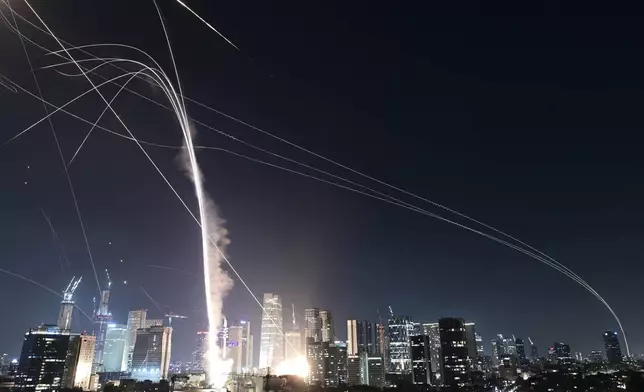 Israeli Iron Dome air defense system fires to intercept missiles over Tel Aviv, Israel, Friday, June 13, 2025. (AP Photo/Tomer Neuberg)