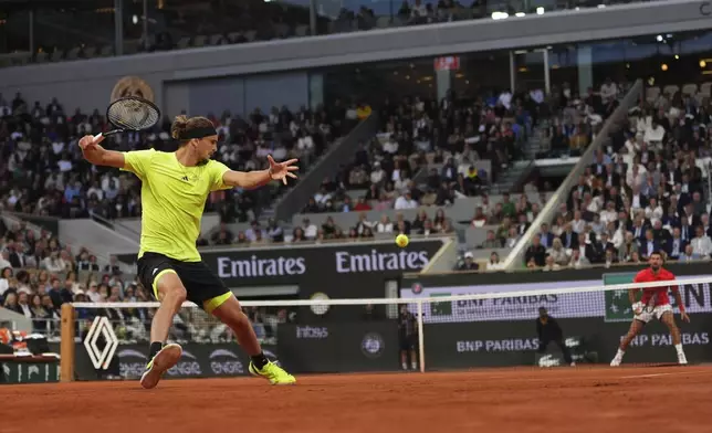 Germany's Alexander Zverev plays a shot against Serbia's Novak Djokovic during their quarterfinal match of the French Tennis Open at the Roland-Garros stadium in Paris, Wednesday, June 4, 2025. (AP Photo/Lindsey Wasson)
