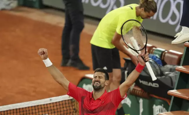 Serbia's Novak Djokovic celebrates as he won the quarterfinal match of the French Tennis Open against Germany's Alexander Zverev at the Roland-Garros stadium in Paris, Wednesday, June 4, 2025. (AP Photo/Aurelien Morissard)