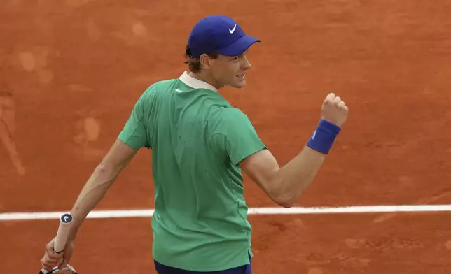 Italy's Jannik Sinner celebrates as he won the quarterfinal match of the French Tennis Open against Kazakhstan's Alexander Bublik at the Roland-Garros stadium in Paris, Wednesday, June 4, 2025. (AP Photo/Aurelien Morissard)