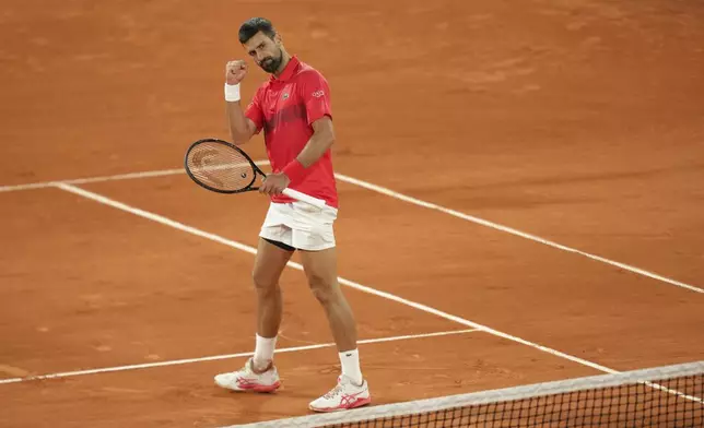 Serbia's Novak Djokovic reacts during the quarterfinal match of the French Tennis Open against Germany's Alexander Zverev at the Roland-Garros stadium in Paris, Wednesday, June 4, 2025. (AP Photo/Aurelien Morissard)
