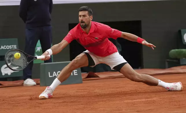 Serbia's Novak Djokovic plays a shot against Germany's Alexander Zverev during their quarterfinal match of the French Tennis Open at the Roland-Garros stadium in Paris, Wednesday, June 4, 2025. (AP Photo/Aurelien Morissard)