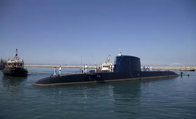 FILE - Israeli navy sailors stand atop the submarine "Rahav" upon its arrival at the military port in Haifa, Israel, on Jan. 12, 2016. (AP Photo/Ariel Schalit, File)