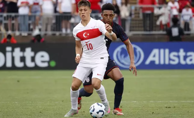 Turkey forward Arda Güler (10) controls the ball ahead of United States defender Alex Freeman (16) during the second half of an international friendly soccer game, Saturday, June 7, 2025, in East Hartford, Conn. (AP Photo/Mary Schwalm)