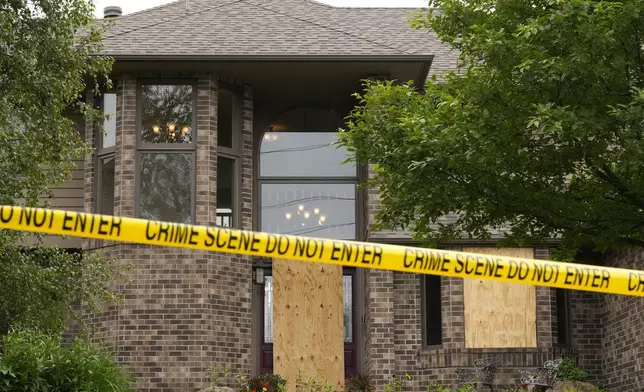 Police tape blocks off the home of Minnesota state Rep. Melissa Hortman, Sunday, June 15, 2025, in Brooklyn Park, Minn. (AP Photo/George Walker IV)