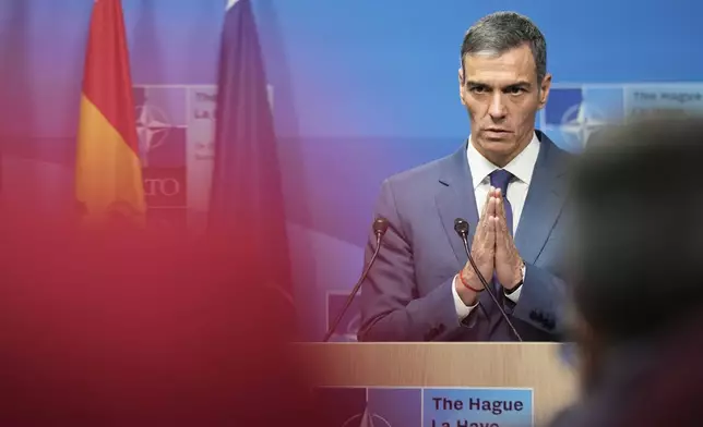 Spain's Prime Minister Pedro Sanchez gestures during a press conference after the plenary session at the NATO summit in The Hague, Netherlands, Wednesday, June 25, 2025. (AP Photo/Markus Schreiber)