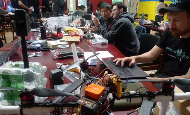 Participants gather for the London Defence Tech Hackathon, a weekend brainstorming solution for technical challenges, at the Royal Military Academy Sandhurst in Camberley, England, May 10, 2025. (AP Photos/Kelvin Chan)