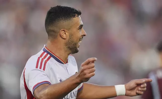 Orlando City midfielder Martín Ojeda reacts after scoring against he Colorado Rapids in the first half of an MLS soccer match Saturday, June 14, 2025, in Commerce City, Colo. (AP Photo/David Zalubowski)