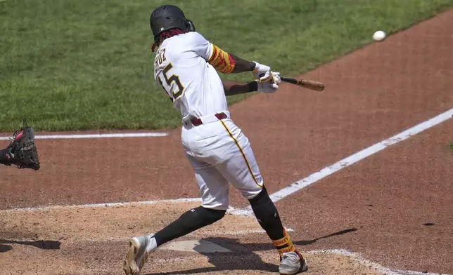 Pittsburgh Pirates' Oneil Cruz hits a two-run home run off New York Mets pitcher Dedniel Núñez during the seventh inning of a baseball game in Pittsburgh, Sunday, June 29, 2025. (AP Photo/Gene J. Puskar)