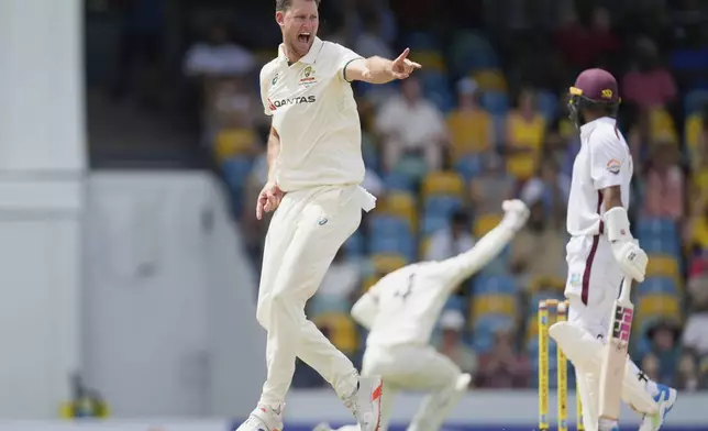 Australia's Beau Webster celebrates taking the wicket of West Indies' Shai Hope on day two of the first cricket Test match at Kensington Stadium in Bridgetown, Barbados, Thursday, June 26, 2025. (AP Photo/Ricardo Mazalan)