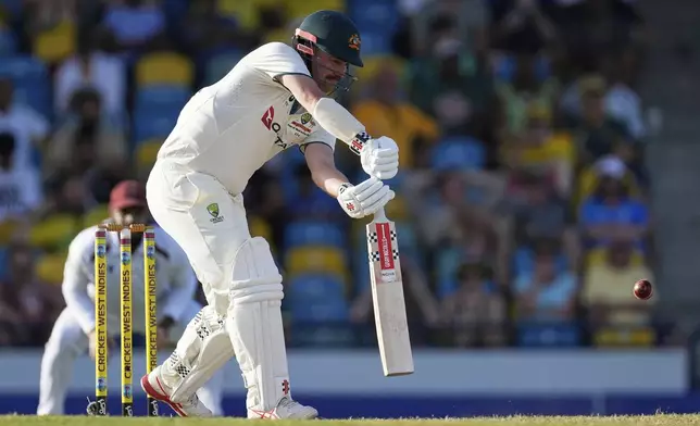 Australia's Travis Head plays a shot against West Indies on day two of the first cricket Test match at Kensington Stadium in Bridgetown, Barbados, Thursday, June 26, 2025. (AP Photo/Ricardo Mazalan)
