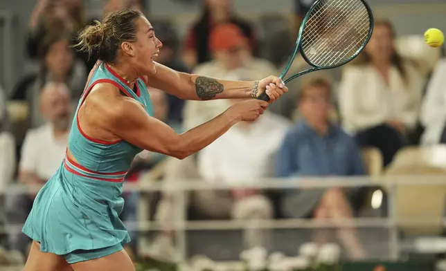 Aryna Sabalenka of Belarus plays a shot against Poland's Iga Swiatek during their semifinal match of the French Tennis Open at the Roland-Garros stadium in Paris, Thursday, June 5, 2025. (AP Photo/Thibault Camus)
