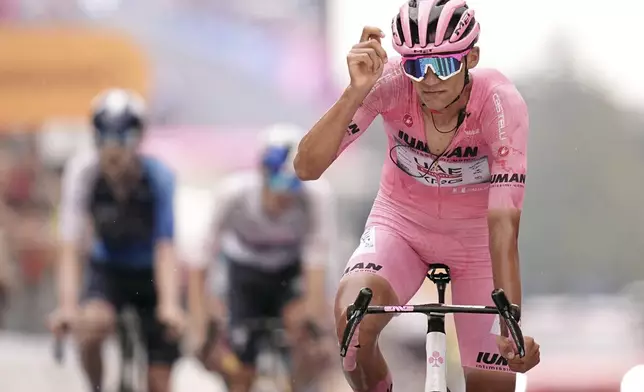 Mexico's Isaac del Toro reacts as he crosses the finish line during stage 20 of the Giro d'Italia from Verres to Sestriere (Via Lattea), Italy, Saturday, May 31, 2025. (Marco Alpozzi/LaPresse via AP)