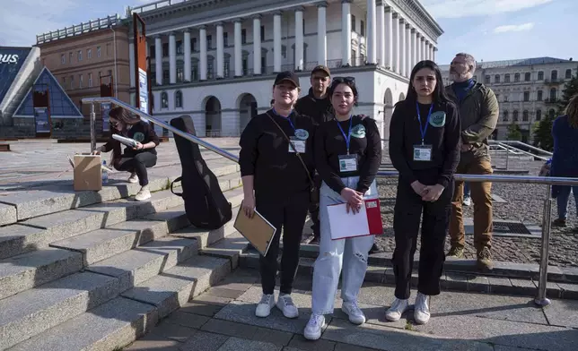 Olha Kurtmalaieva, center, participates a meeting for captive Ukrainian marine soldiers at the Independence square in Kyiv, Ukraine, on Friday, May 23, 2025. (AP Photo/Evgeniy Maloletka)