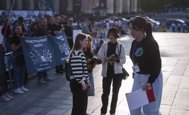 Olha Kurtmalaieva participates a meeting for captive Ukrainian marine soldiers at the Independence square in Kyiv, Ukraine, on Friday, May 23, 2025. (AP Photo/Evgeniy Maloletka)