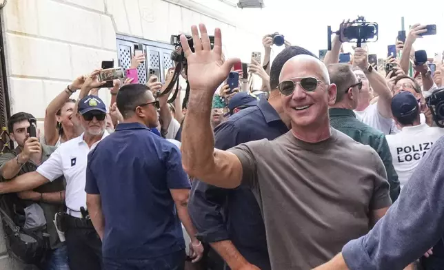 Jeff Bezos leaveS the Harry's Bar in Venice, Italy, Saturday,June 28, 2025, the day after his wedding with Lauren Sanchez Bezos. (AP Photo/Luca Bruno)