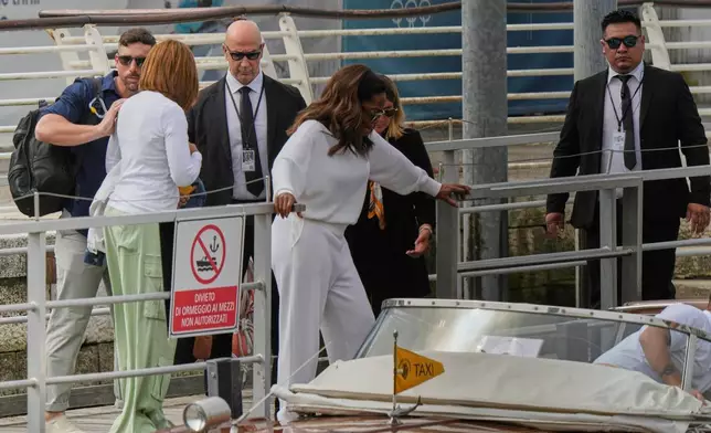Oprah Winfrey, center, arrives for the weekend wedding of Amazon founder Jeff Bezos and Lauren Sanchez, in Venice, Italy, Thursday, June 26, 2025. (AP Photo/Luca Bruno)