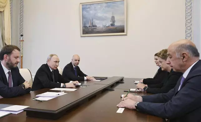 Russian President Vladimir Putin, second left, speaks with the President of the New Development Bank Dilma Rousseff, second right, on the sidelines of the St. Petersburg International Economic Forum in St. Petersburg, Russia, Wednesday, June 18, 2025. (Alexei Danichev, Sputnik, Kremlin Pool Photo via AP)