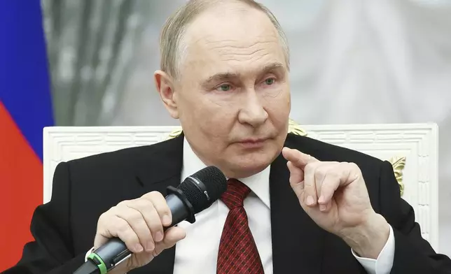 FILE - Russian President Vladimir Putin speaks at the Kremlin in Moscow, Russia, on Thursday, June 12, 2025, with participants of the Time of Heroes, an educational program for veterans of the conflict in Ukraine. (Sergei Bulkin, Sputnik, Kremlin Pool Photo via AP, File)